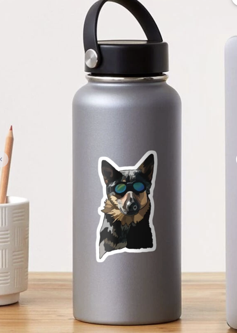 A Sticker of a german shepherd wearing goggles on a gray water bottle.